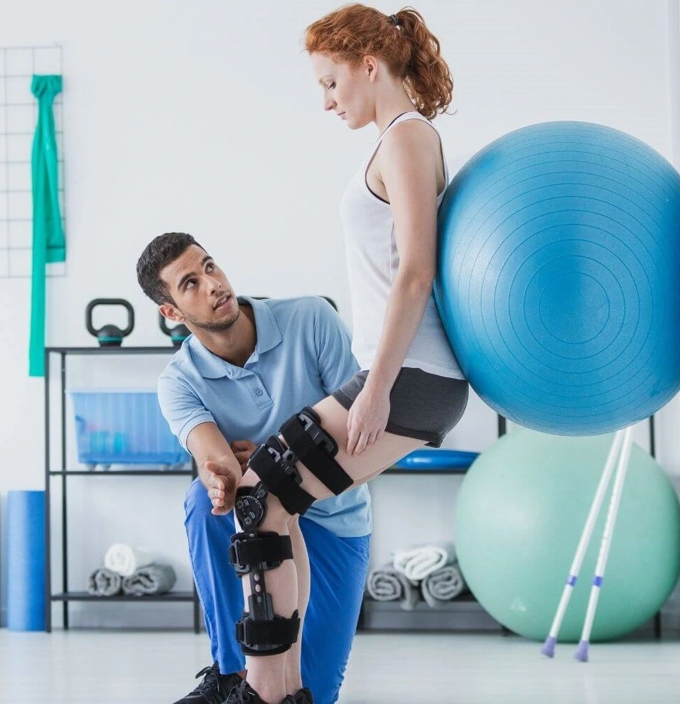 A man helping a woman in exercise